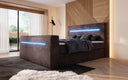 Boxspringbett Sejour mit TV Lift, RGB und Stauraum in Cord